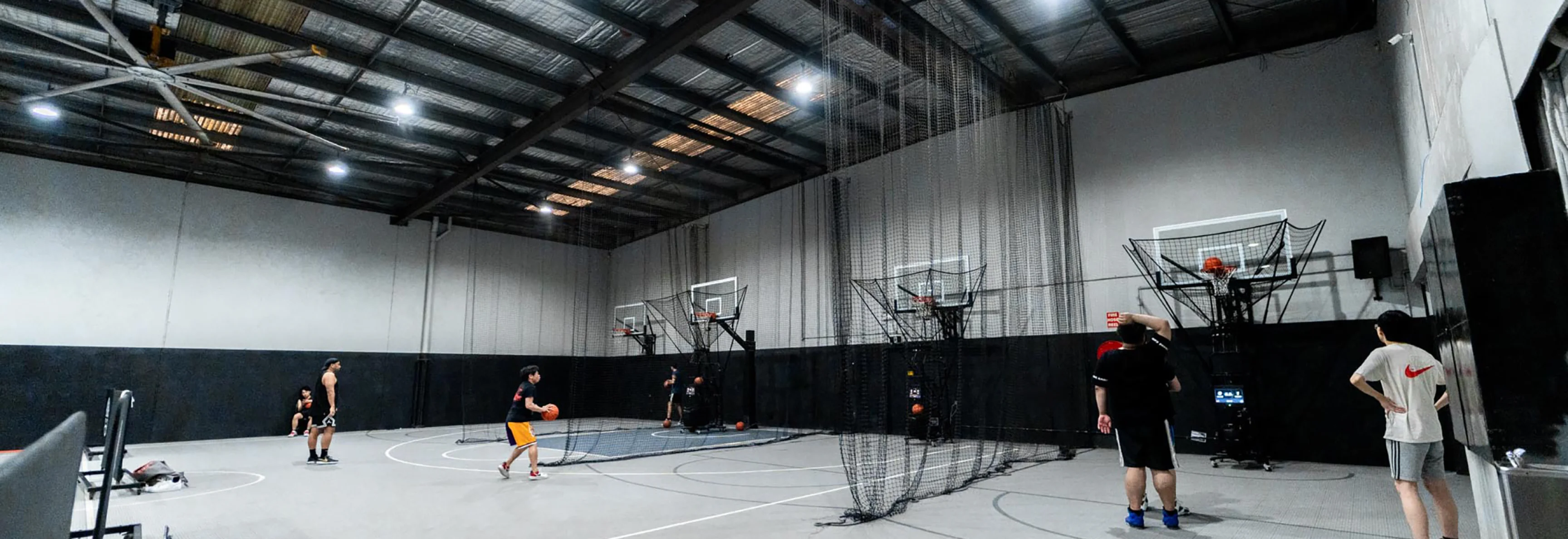 Housed Alexandria basketball facilities overview showing NCAA half courts, shooting machines, and modern facilities