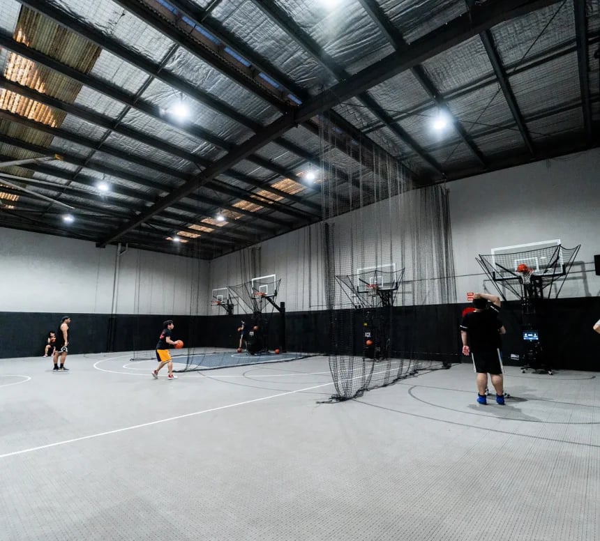 Housed Alexandria basketball facilities overview showing NCAA half courts, shooting machines, and modern facilities