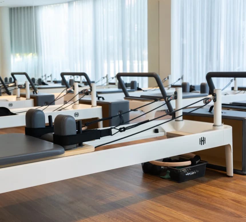 Housed Chatswood pilates studio facilities overview showing reformer pilates equipment, studio space, and modern reception area