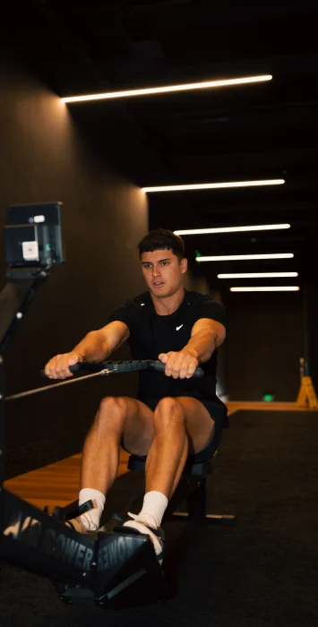 Strength and group training classes at Housed Sydney - member performing functional fitness exercises